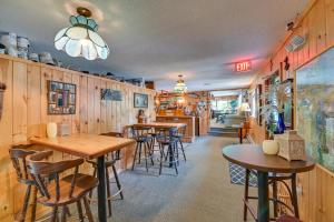 a restaurant with wooden walls and tables and chairs at Lake Champlain On-Site! Waterfront Studio w/ Dock in Willsboro