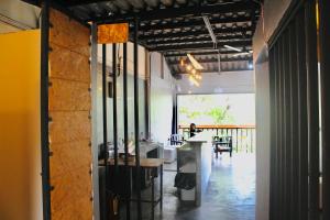 a room with a counter and a table in it at Crew Bangkok Hostel in Bangkok