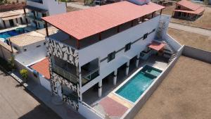 an overhead view of a house with a swimming pool at Vila Bangalô in São José da Coroa Grande