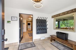 a hallway with a mirror and a bench at Lone Mountain Lookout in Big Sky