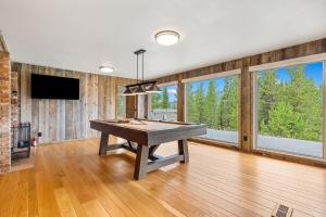 a room with a ping pong table in it at Lone Mountain Lookout in Big Sky +51 photos