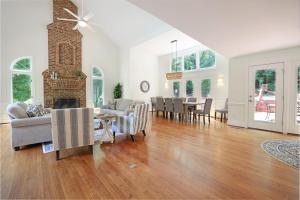 a living room with a fireplace and a dining room at Lg Pool House w Hot Tub Central to RTPPool OPEN in Durham +91 photos