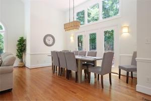 a dining room with a table and chairs at Lg Pool House w Hot Tub Central to RTPPool OPEN in Durham