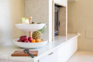 a bowl of fruit on a counter in a room at Villa Francesca Toscolano in Toscolano Maderno