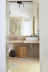 a bathroom with a sink and a mirror at Villa Francesca Toscolano in Toscolano Maderno