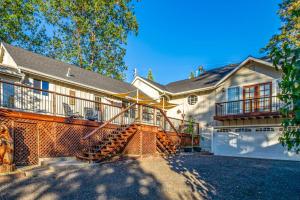 a large house with a staircase in front of it at Brier Escape in Bass Lake
