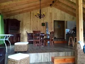 a dining room with a table and chairs at Casa Monita in El Quisco