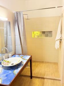 a bathroom with a sink and a shower at Bakarani in Mombasa +29 photos