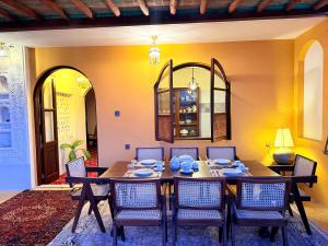 a dining room with a table and chairs at Bakarani in Mombasa
