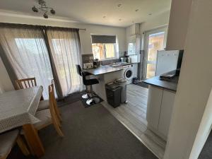 a kitchen with a sink and a counter top at Hinckley Home Leysmill in Hinckley +3 photos