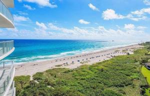 an aerial view of a beach with people on it at Luxury Ocean View 2BR in Riviera Beach