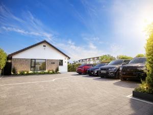 a group of cars parked in a parking lot at Galway Paradisus in Galway