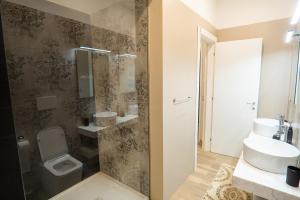 a bathroom with a toilet and a sink at Covo di Levante, in La Spezia