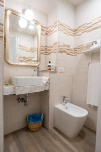 a bathroom with a sink and a mirror at Covo di Levante, in La Spezia
