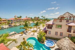 an aerial view of a resort with a swimming pool at Magnificent Belize Townhouse-Pool-Private Island in Placencia