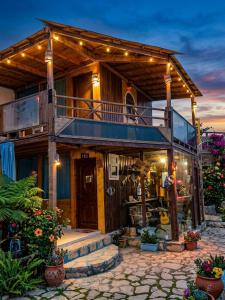 a house with a balcony and stairs in front of it at Salah boutique camp in Nuweiba