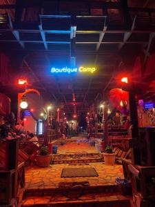 a store with a souciplinary camp sign on the ceiling at Salah boutique camp in Nuweiba