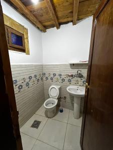 a bathroom with a toilet and a sink at Salah boutique camp in Nuweiba +81 photos