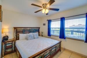 a bedroom with a bed and a ceiling fan at 'Sea-King Sol' Ocean-View Condo in Port Aransas! in Port Aransas +25 photos