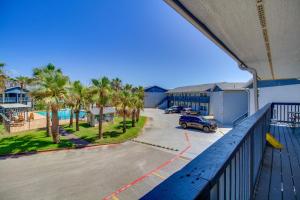 a balcony with a car parked in a parking lot at 'Sea-King Sol' Ocean-View Condo in Port Aransas! in Port Aransas