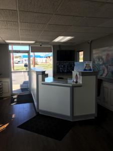 an empty office with a white counter top in a room at Travelodge by Wyndham Gallipolis in Gallipolis