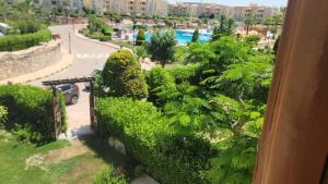 a view of a garden from a balcony of a building at Villa Marsilea in Dawwār Muḩammad Abū Shanab