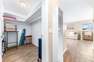 a living room with a hallway and a room with at Del Mar Studio - Walk to Beach in San Diego +11 photos
