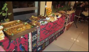a table with a buffet of food on it at Apartman Kopaonik Brzeće in Brzeće