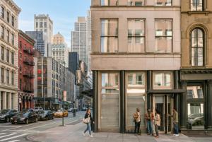 a group of people standing outside of a building on a city street at Duane Street Hotel Tribeca, Belvilla District 6 Formerly Sonder in New York