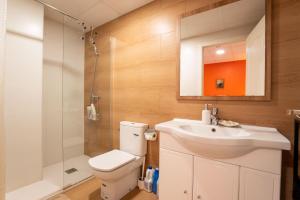 a bathroom with a toilet and a sink and a shower at Mirador 2 del Mercado Central - habitacion con baño privado en el centro de la Ciudad Vella in Valencia +50 photos