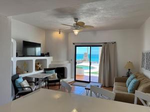 a living room with a view of the ocean at Paradise Villa #5 in Puerto Peñasco