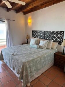 a bedroom with a large bed in a room at Paradise Villa #5 in Puerto Peñasco +19 photos