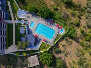 an overhead view of a swimming pool in a building at Olympus Thea Boutique Hotel in Platamonas