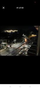 a view of a city at night with a plane at Jenny's accomodation in Baguio +8 photos