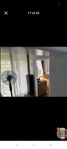 a view of a living room with a table in a room at Jenny's accomodation in Baguio
