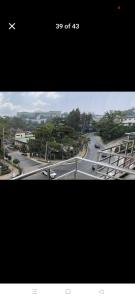 an overhead view of a road with an airplane flying over it at Jenny's accomodation in Baguio