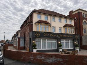a building with a dodge programme sign on it at 262 Ocean Manor in Blackpool