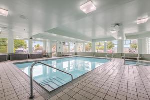 a swimming pool in a hotel room with at Ramada by Wyndham Surrey/Langley in Langley