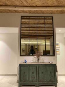 a mirror above a dresser in a room at Casa de Campo Urpichay in Ricardo Palma +48 photos