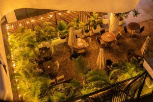 an overhead view of a restaurant with tables and plants at Beaufort Ridge - Skysuites in Accra