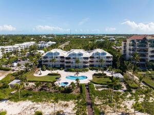 an aerial view of a resort with a pool and resort at Grace Bay Beach Front Penthouse in Long Bay Hills