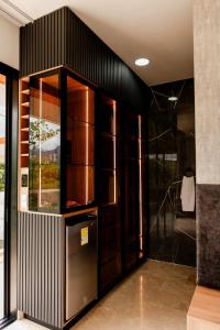 a kitchen with black walls and stainless steel appliances at ECO HOTEL RIO DE ORO in San Rafael