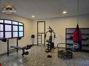 a fitness room with a gym with a punching bag at Hostel Paricutín in Uruapan del Progreso +9 photos