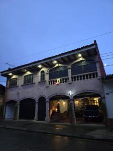 a large building with a lot of windows at Hostel Paricutín in Uruapan del Progreso