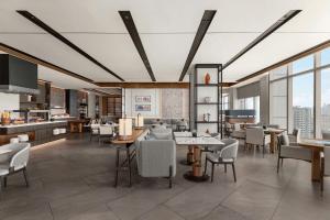 a rendering of a restaurant with tables and chairs at Sheraton Manila Bay in Manila