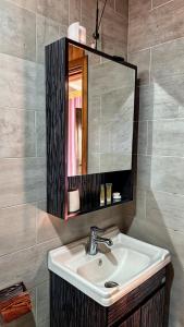 a bathroom with a sink and a mirror at RUM PRESTIGE lUXURY CAMP & DESERT TOURS in Wadi Rum +52 photos
