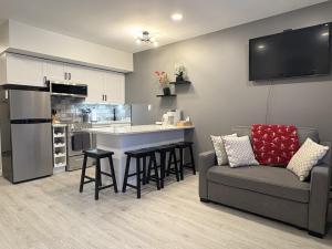 a living room with a couch and a kitchen at Loon Resort Condo-AC, Pool, Hot Tub and Views in Lincoln