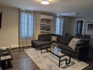 a living room with a couch and a coffee table at Clifton Hill Suite 3301 in Niagara Falls