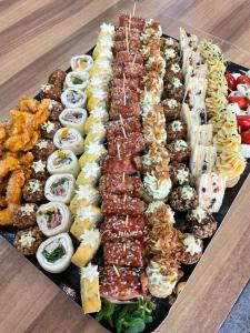a tray of different types of food on a table at Casa Luca in Vama