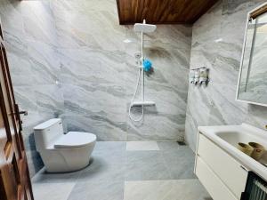a bathroom with a shower and a toilet and a sink at Cat Tien Vista in Tân Phú +221 photos